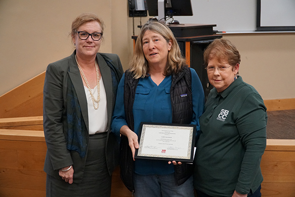 picture of Karen receiving honorable mention for oustanding classified member of year at April 2019 Board meeting
